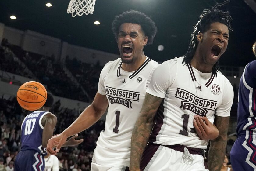Mississippi State forward Tyler Stevenson, right, and forward Tolu Smith (1) celebrate after scoring and drawing a foul from a TCU player during the second half of an NCAA college basketball game in Starkville, Miss., Saturday, Jan. 28, 2023. (AP Photo/Rogelio V. Solis)