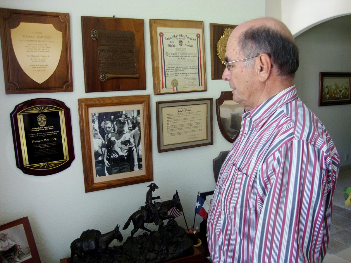 Former Austin police Sgt. Ramiro "Ray" Martinez has several awards for bravery on the wall of his home.