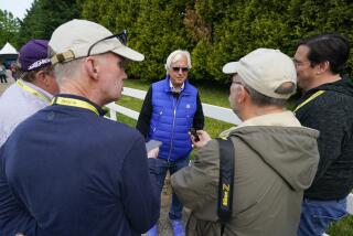 Trainer Bob Baffert speaks to reporters at Pimlico Race Course.