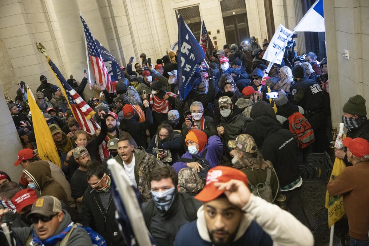 Protesters supporting Donald Trump gather near the east front door of the U.S. Capitol