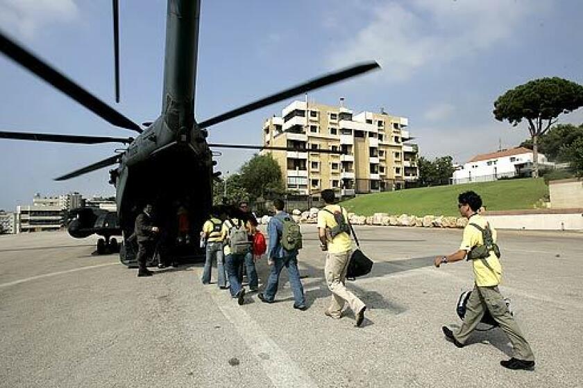Lebanese high school exchange students board a U.S. Air Force helicopter parked on the grounds of the American Embassy in Beirut. Sponsored by the Youth Exchange and Study (YES) scholarship program, 27 students destined for the United States were airlifted after weeks of uncertainty due to the war.
