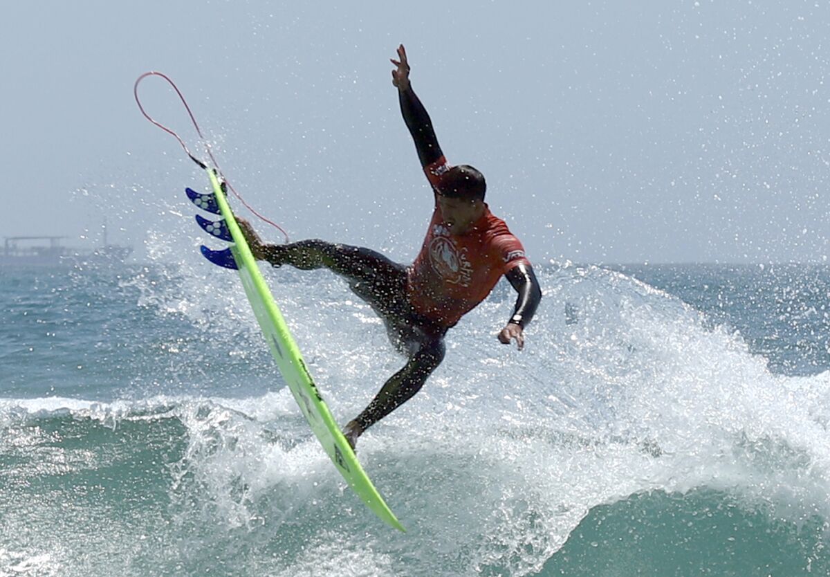 Zeke Lau of Hawaii gets some serious air during the final heat of the U.S. Open of Surfing on Sunday in Huntington Beach.