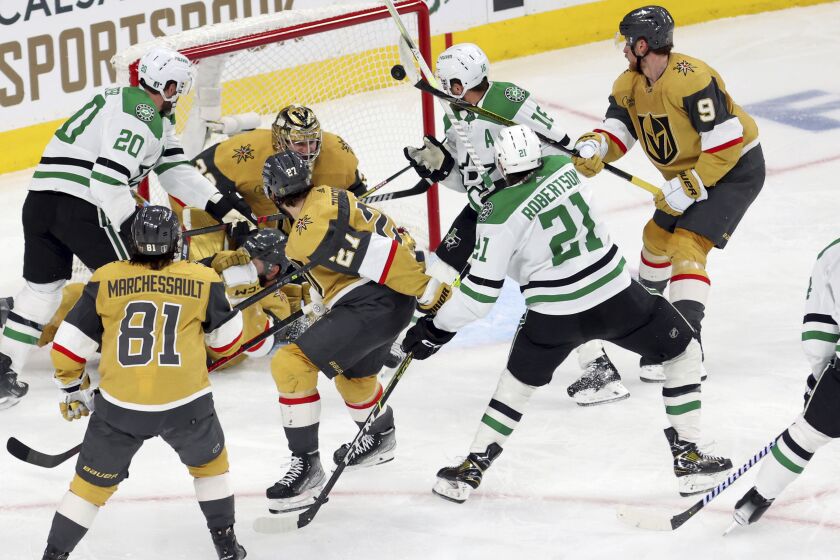 Dallas Stars left wing Jason Robertson (21) scores in the second period during Game 5 of the NHL hockey Stanley Cup Western Conference finals against the Vegas Golden Knights, Saturday, May 27, 2023, in Las Vegas. (AP Photo/Ronda Churchill)