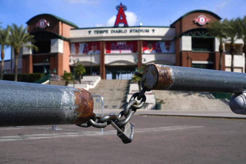 A gate is locked at the main parking lot of the Angels training site, Tempe Diablo Stadium.