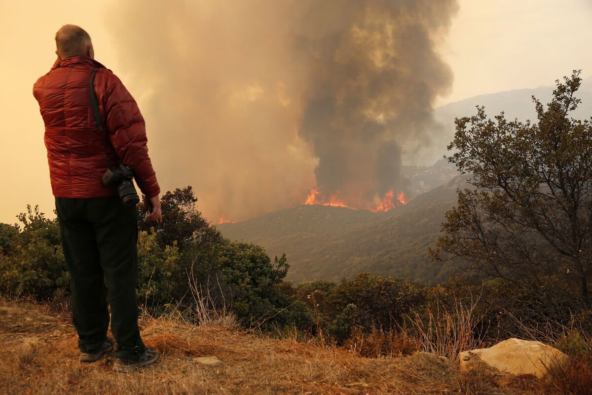 Ray Ford with Noozhawk watches flames erupt above Santa Barbara.