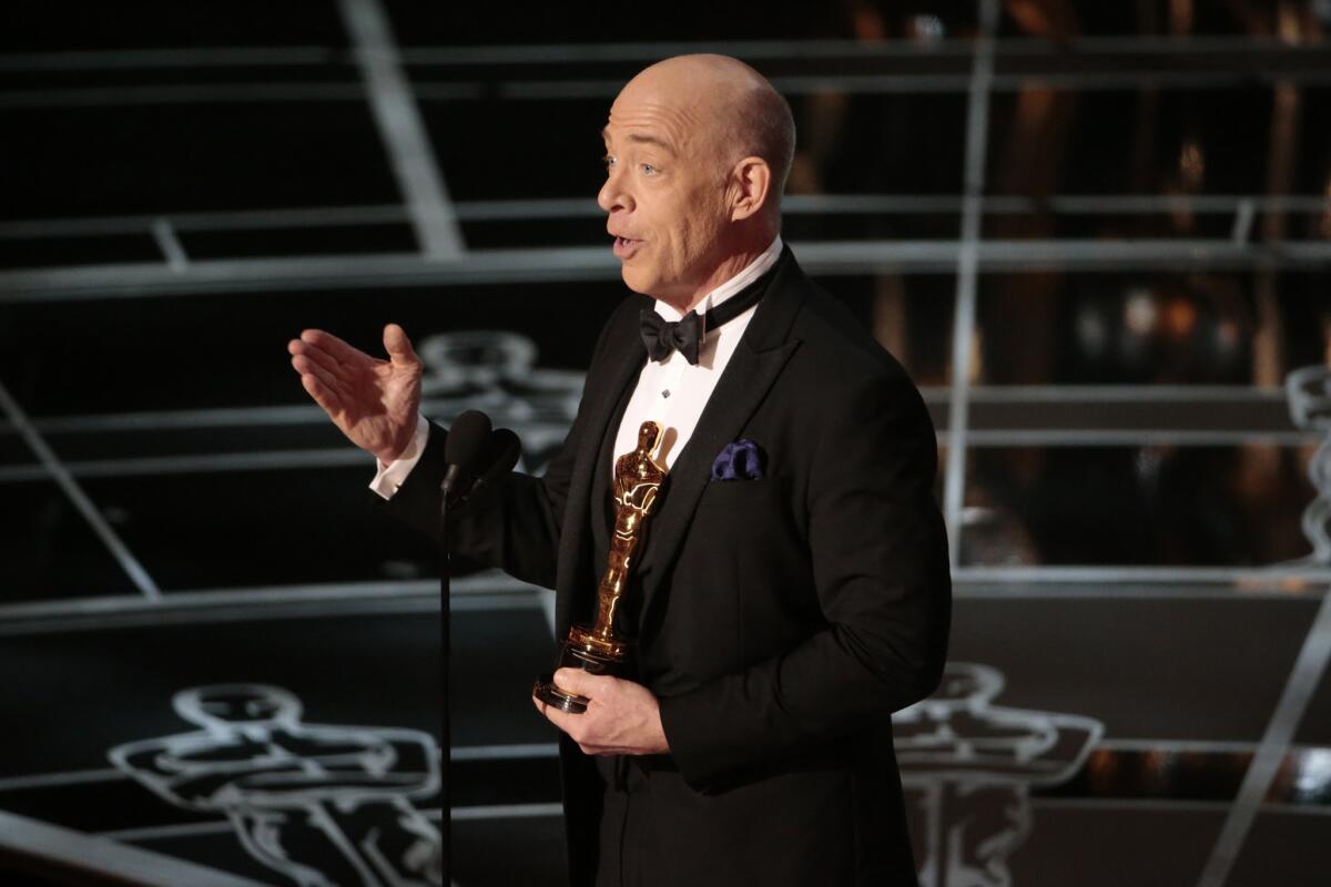 J.K. Simmons accepts the supporting actor Oscar on Sunday.