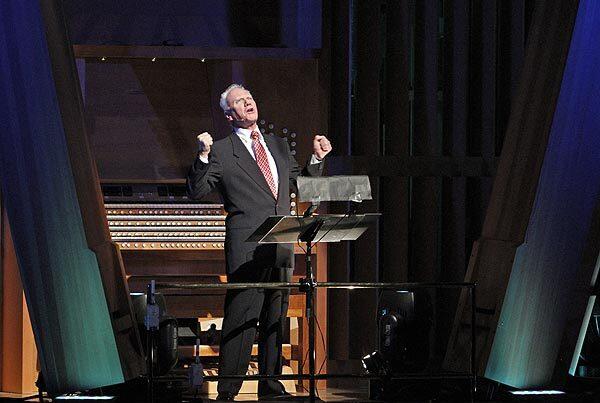 Malcolm McDowell performs as Prospero in a scene from "The Tempest" before the Los Angeles Philharmonic, conducted by Gustavo Dudamel, performs the corresponding musical composition by Tchaikovsky.