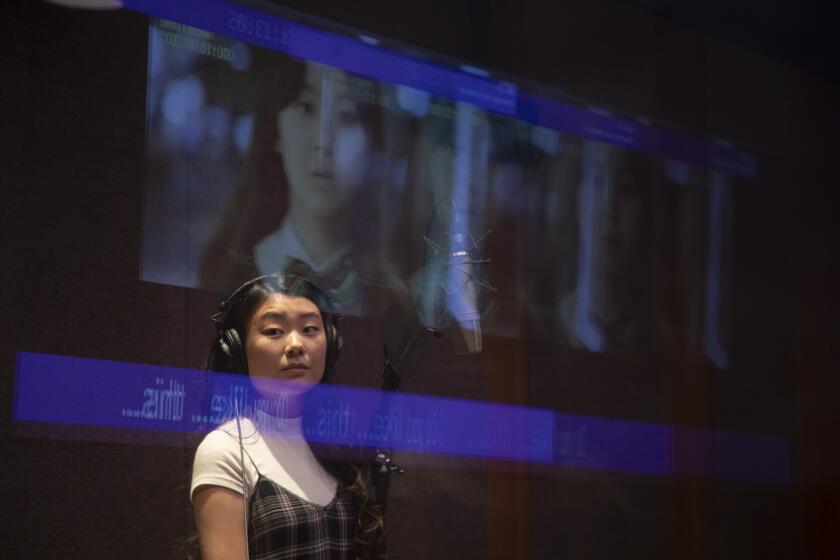 LOS ANGELES, CA - FEBRUARY 10: Voice actor Victoria Grace as "On-jo" looks to the control room during a demonstation of the dubbing process for the Netflix show, "All of Us Are Dead." (THIS WAS A DEMONSTRATION OF THE PROCESS. THE EPISODES HAVE ALREADY BEEN DUBBED). Photographed at Netflix on Thursday, Feb. 10, 2022 in Los Angeles, CA. (Myung J. Chun / Los Angeles Times)