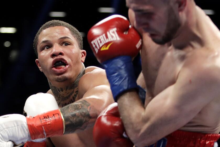 Gervonta Davis punches Jose Pedraza, of Puerto Rico, during the third round of a junior lightweight boxing bout Saturday, Jan. 14, 2017, in New York. Davis stopped Pedraza in the seventh round. (AP Photo/Frank Franklin II)