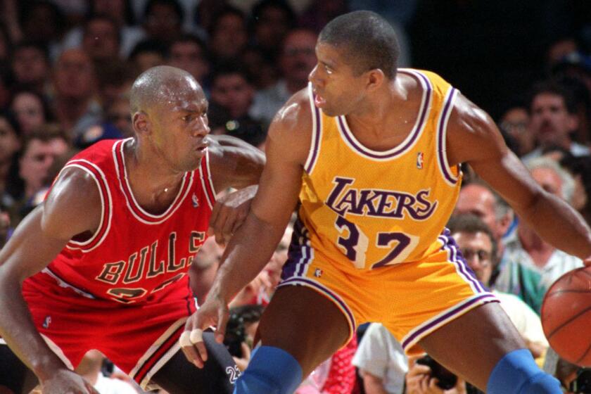 S.MagicMichael.#3.0129.LS/d. Lakers Earvin Johnson tries to move past Chicagos Bulls Michael Jordan during the NBA finals in 1991.