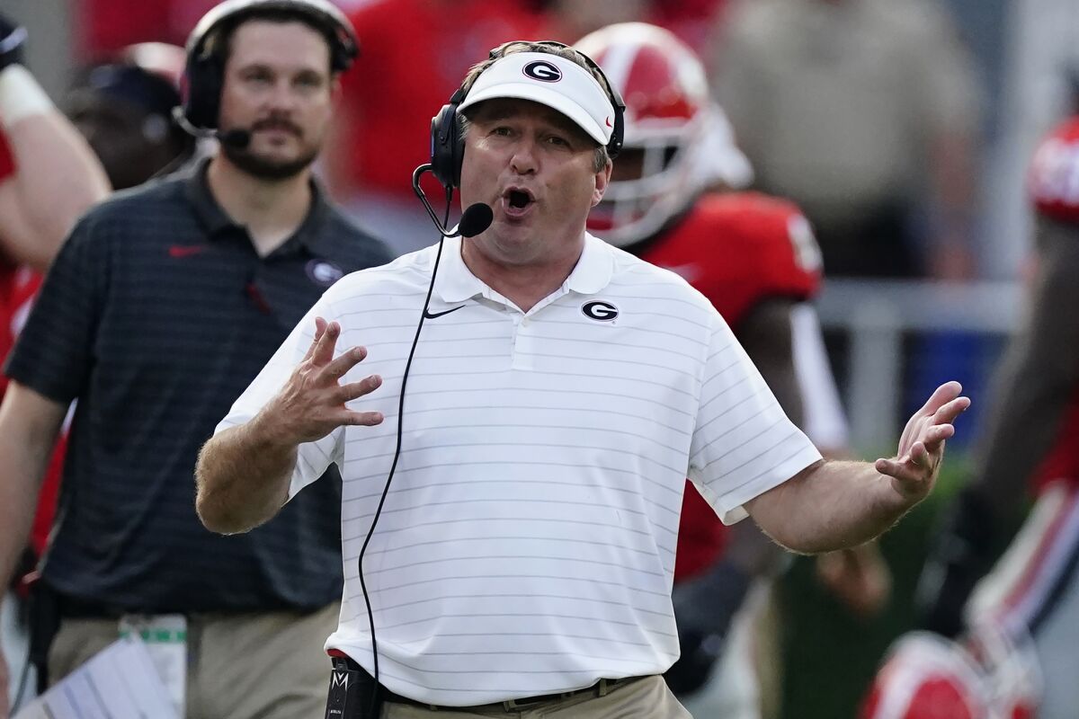 Georgia head coach Kirby Smart talks on his headset during an NCAA college football game against UAB, Saturday, Sept. 11, 2021, in Athens, Ga. (AP Photo/John Bazemore)