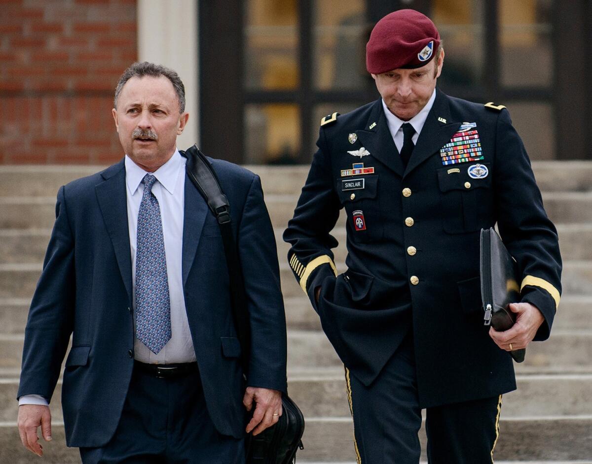 In this March 4 file photo, Brig. Gen. Jeffrey Sinclair, right, leaves the courthouse with a lawyer.