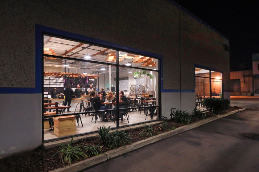 An evening view of customers inside Meadiocrity meadery on Grand Avenue in San Marcos in this 2019 photo.