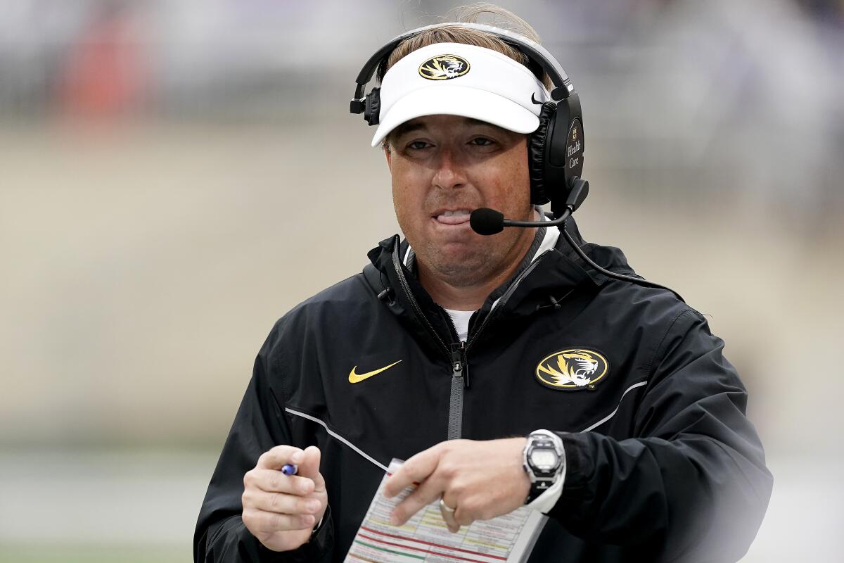 Missouri head coach Eliah Drinkwitz watches during the first half of an NCAA college football game against Kansas State Saturday, Sept. 10, 2022, in Manhattan, Kan. (AP Photo/Charlie Riedel)