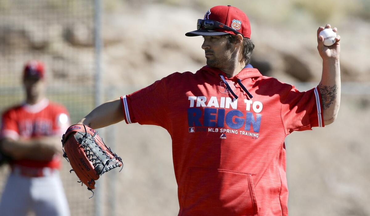 C.J. Wilson works on a pitching drill during an Angels spring training workout last month.