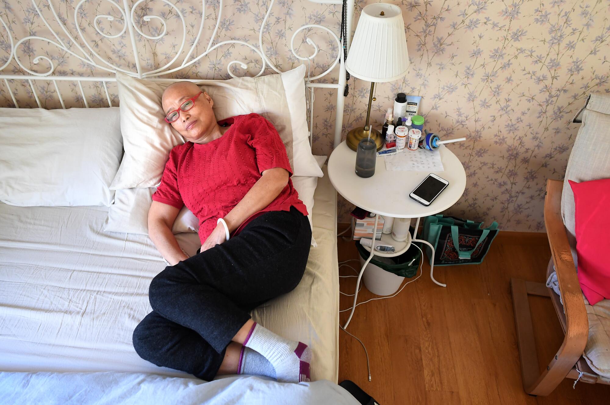Yuyuan Lin, 63, rests in bed at her daughters house in Bradbury. 