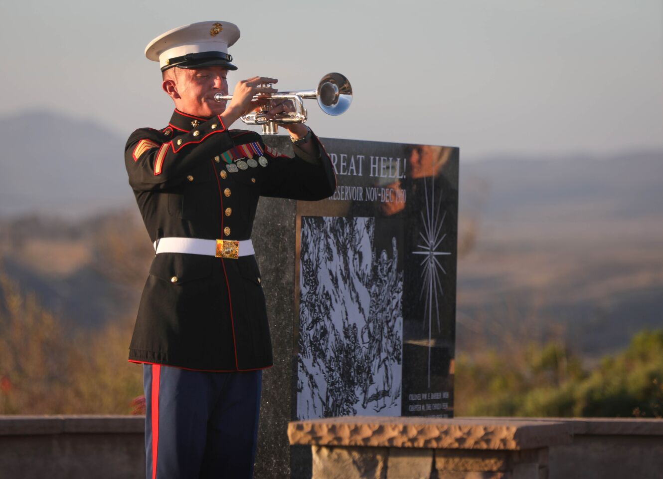 A Marine Corps bugler plays taps at the end of the commemoration ceremony for the 75th anniversary of the World War II Battle of Iwo Jima, February 15, at Camp Pendleton.This is the last time the Iwo Jima Commemorative Committee is planning to hold a formal West Coast gathering of veterans of the battle.