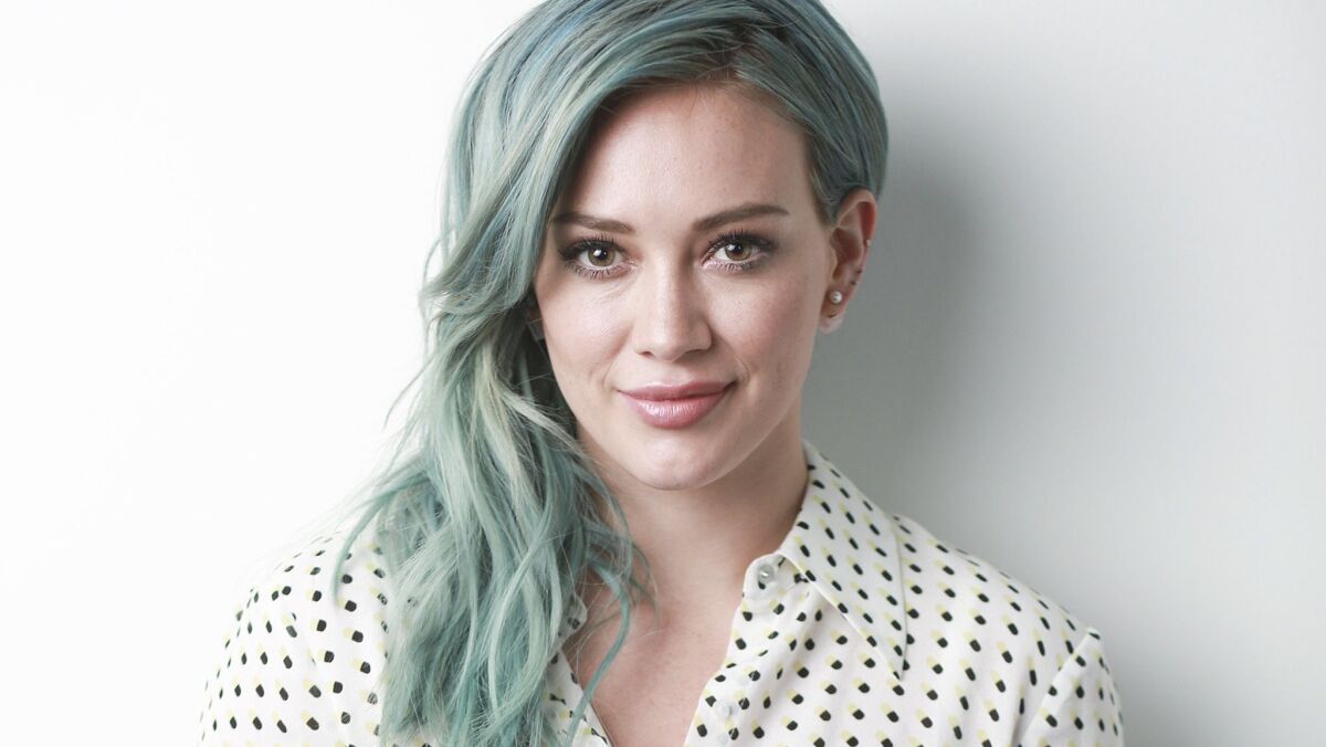 Hilary Duff confirms Tinder account, talks "wildly addicting" app.
