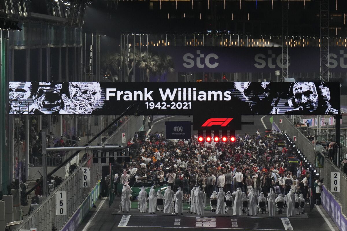 A tribute to Frank Williams is displayed before the start of the Formula One Saudi Arabian Grand Prix in Jiddah, Sunday, Dec. 5, 2021. Williams, the much-loved and inspirational founder of the F1 team bearing his name, died last weekend. (AP Photo/Hassan Ammar)