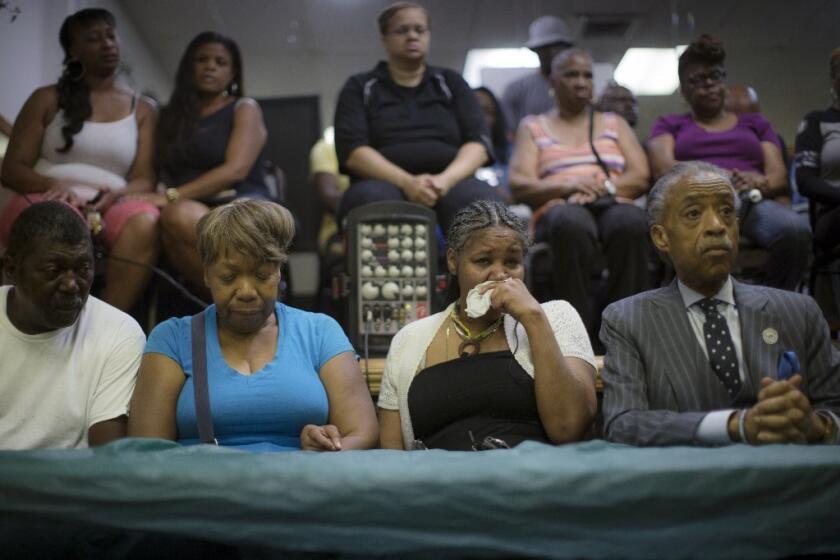 The family of Eric Garner and the Rev. Al Sharpton, right, hours before a protest of the Staten Island man's death.