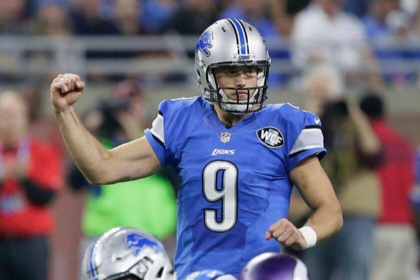 Lions quarterback Matthew Stafford gestures during a game against the Vikings on Thanksgiving Day on Nov. 24.