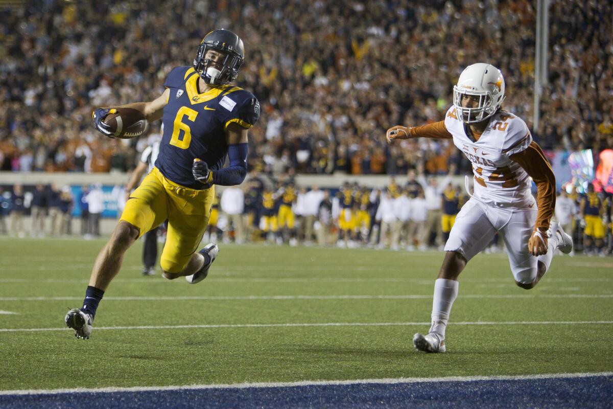 California wide receiver Chad Hansen (6) scores on a two-point conversion against Texas cornerback John Bonney (24) in the fourth quarter on Sept. 17.