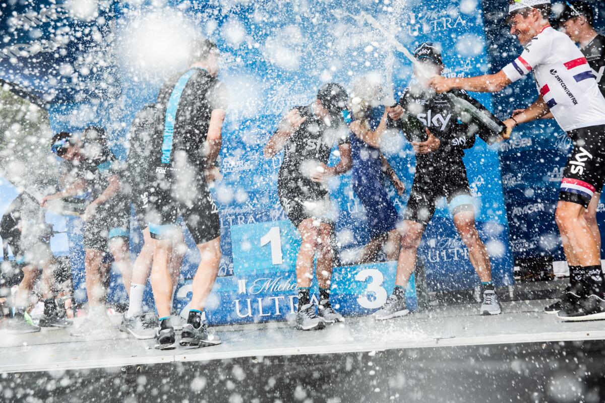 Members of Team Sky unleash their inner child as they celebrate their victory in the team standings with champagne at the end of the Amgen Tour of California, in Pasadena, Calif., on May 17, 2015.