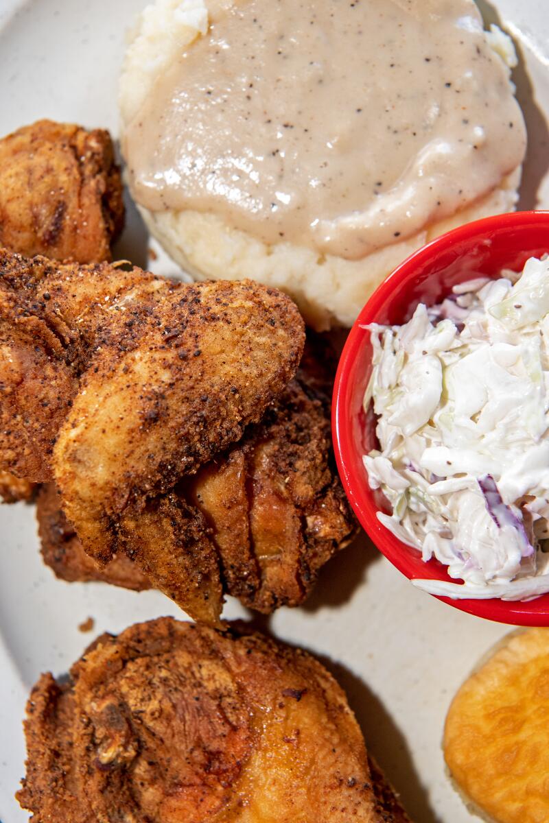 Fried chicken with mashed potatoes and gravy, coleslaw and cornbread from Johnny Rebs' True South.
