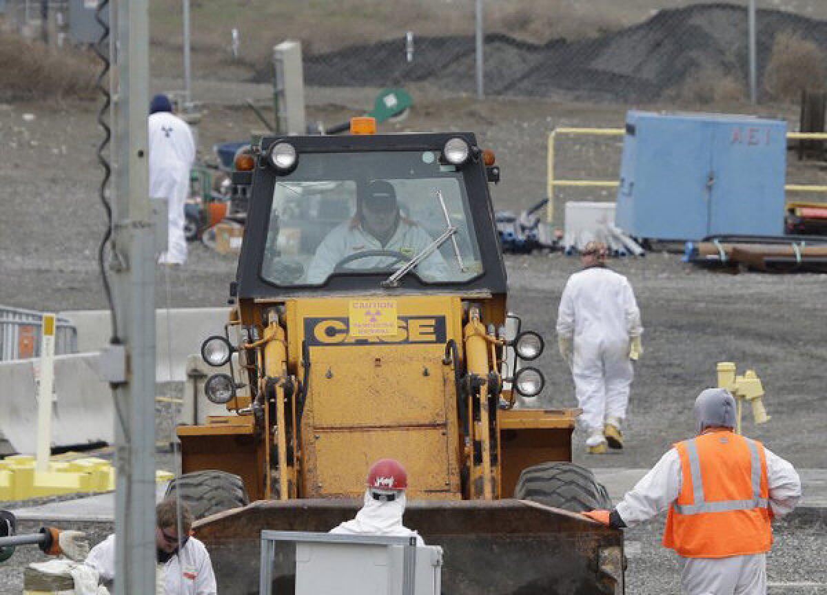 Workers wear protective clothing at the Hanford Nuclear Reservation near Richland, Wash.