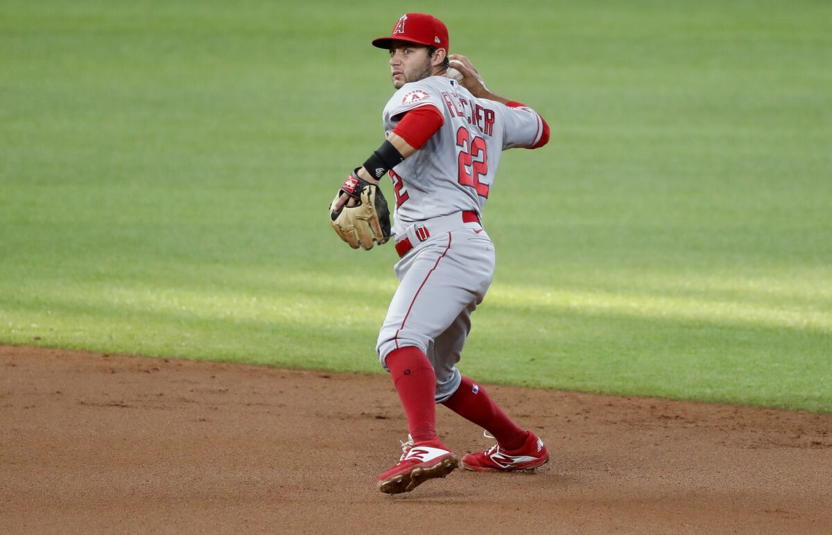 Angels shortstop David Fletcher throws to first during a game against the Texas Rangers on Aug. 8.