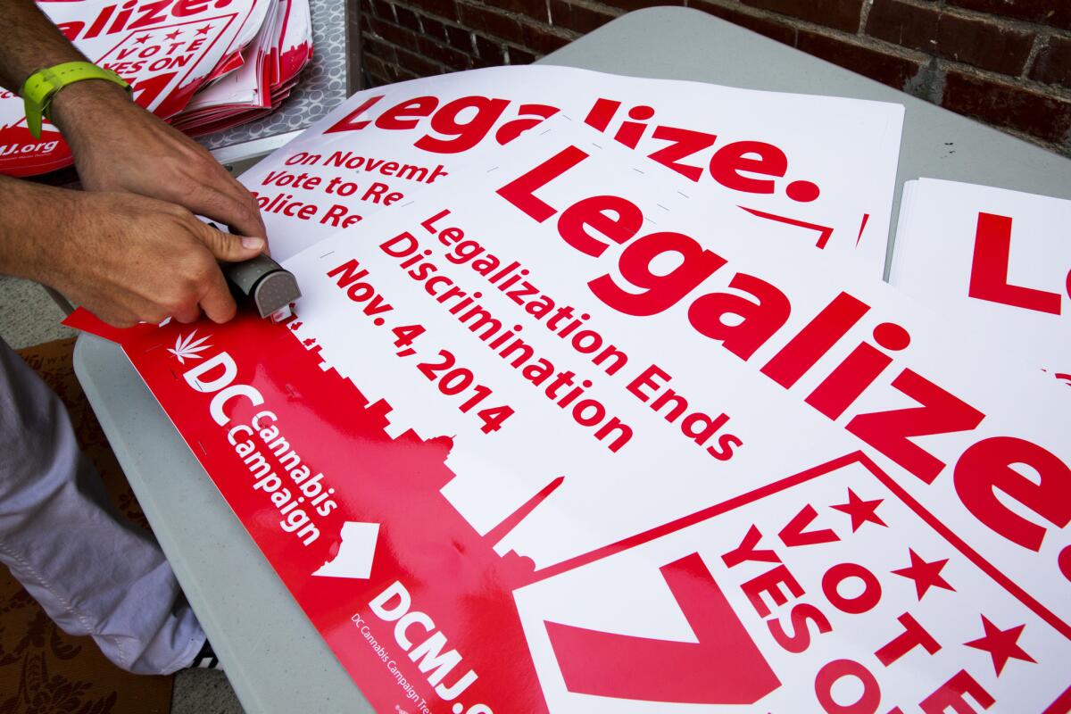 Shown are posters from the successful 2014 campaign that encouraged Washington residents to legalize small amounts of marijuana for personal use.