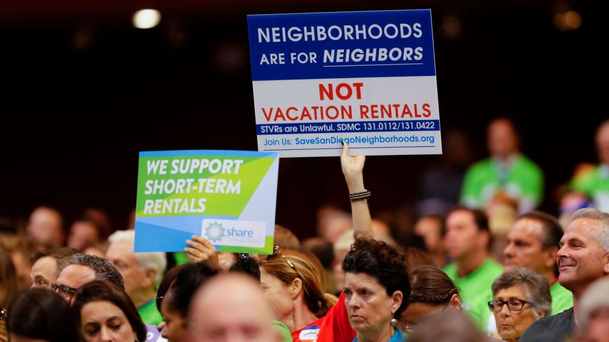 Neighborhood residents show their support and opposition to regulating short-term vacation rentals at a special City Council meeting.