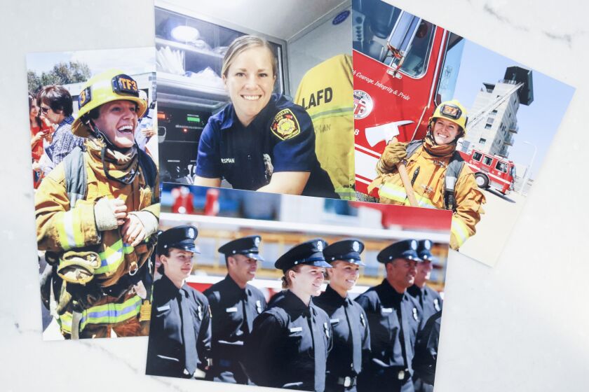 Photos of Katie Becker, a former LA City firefighter who says she was driven out of that department by the sexist attitudes of many of her co-workers, sit on the kitchen island in her home on Wednesday, June 30, 2021 in Parker, Colorado. Becker moved to the Denver suburbs three years ago and is now working for a fire department that she says has a much more progressive view of how women can serve. Becker's complaints about the LAFD are at the center of a current furor within the LA Department about how to overcome sexism and to increase the ranks of women. (Michael Ciaglo / For The Times)
