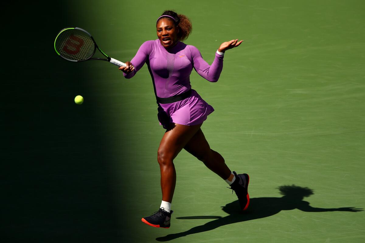Serena Williams returns a shot during her third-round match against Karolina Muchova at the U.S. Open on Friday.