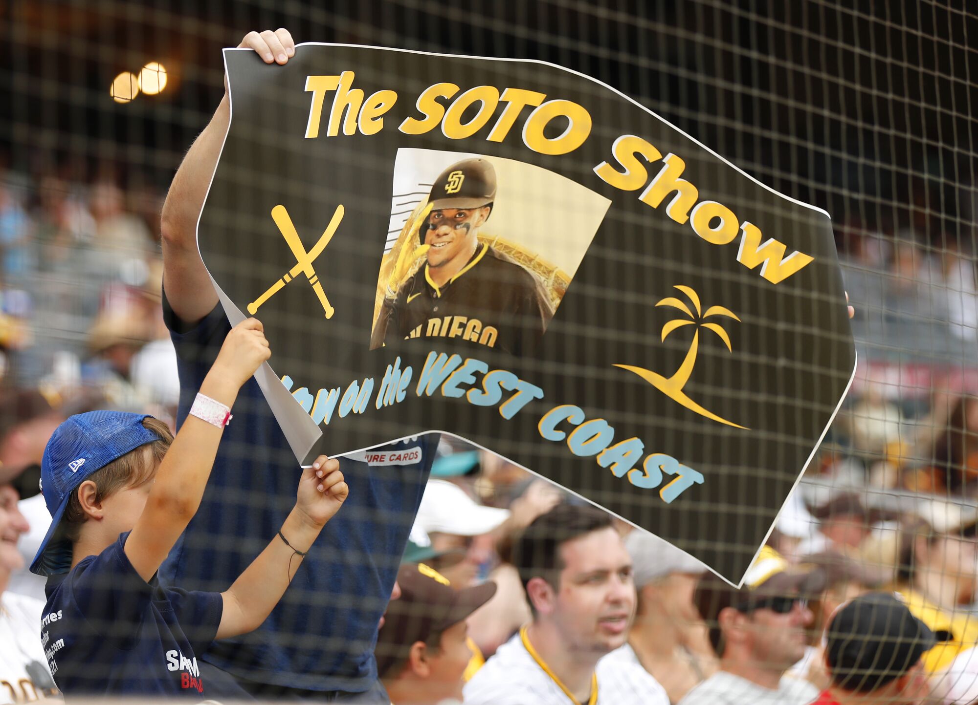 Fans hold up a sign for Juan Soto on Thursday.
