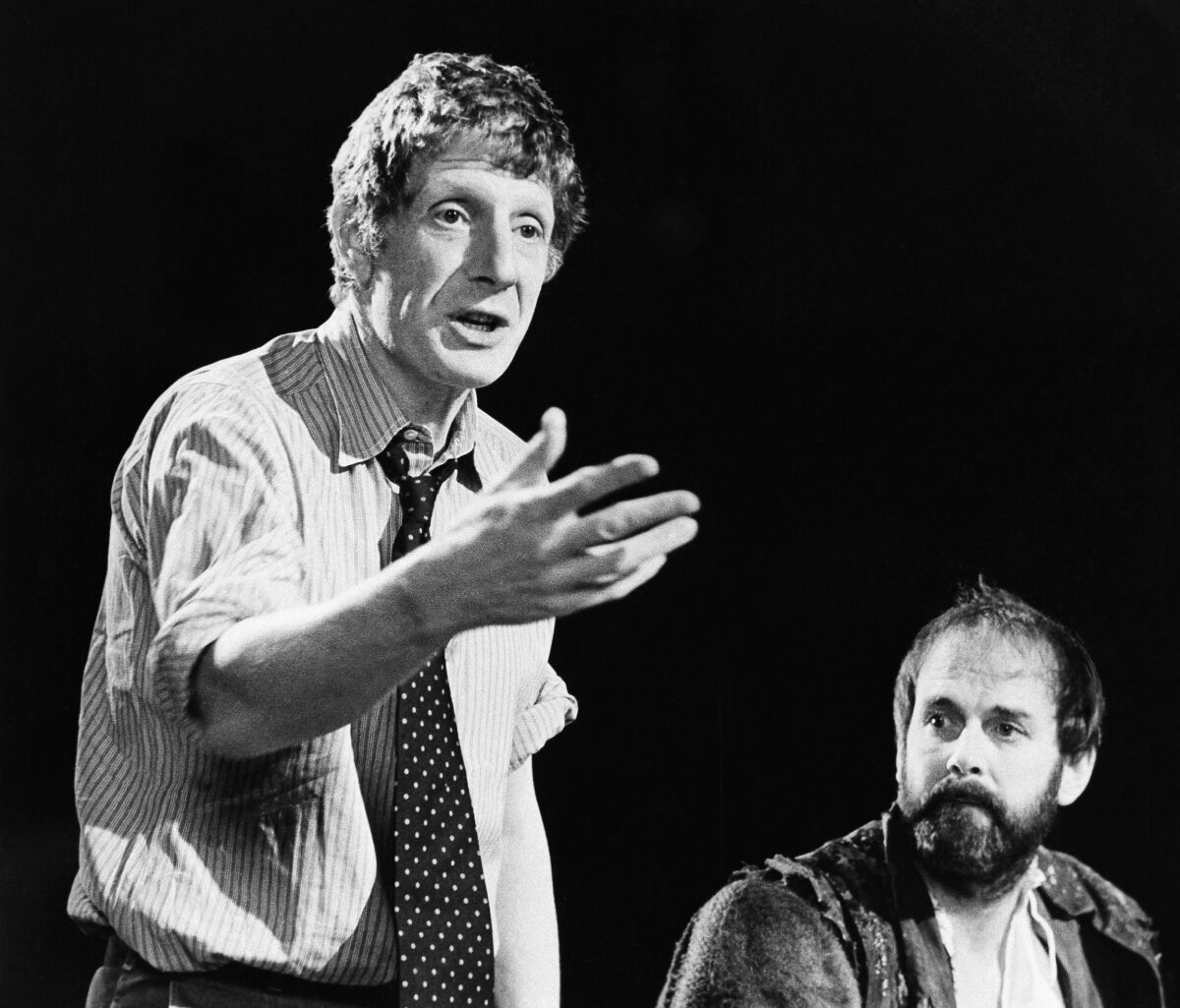  Jonathan Miller, left, directs a 1980 production of Shakespeare's "The Taming of the Shrew" with actor John Cleese, right.
