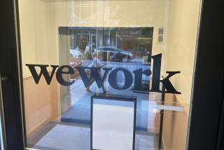 FILE - A sign for WeWork is displayed at their office in the borough of Manhattan in New York, Aug. 9, 2023. Trading in shares of WeWork were halted Monday as rumors that the office sharing company will seek bankruptcy protection. (AP Photo/Ted Shaffrey, File)