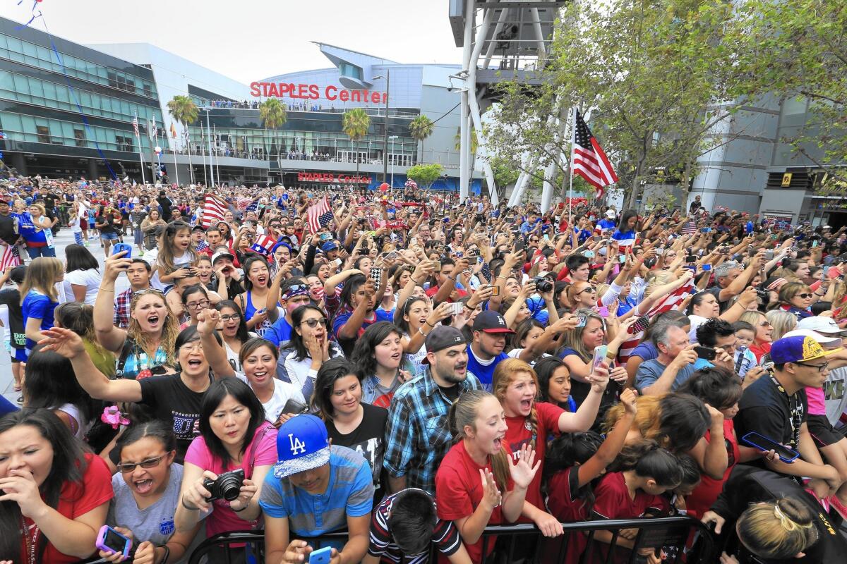 Thousands of fans cheer as the 2015 United States Women’s National Soccer Team takes the stage after winning the FIFA Women’s World Cup at a public championship celebration at L.A. Live in July 2015.