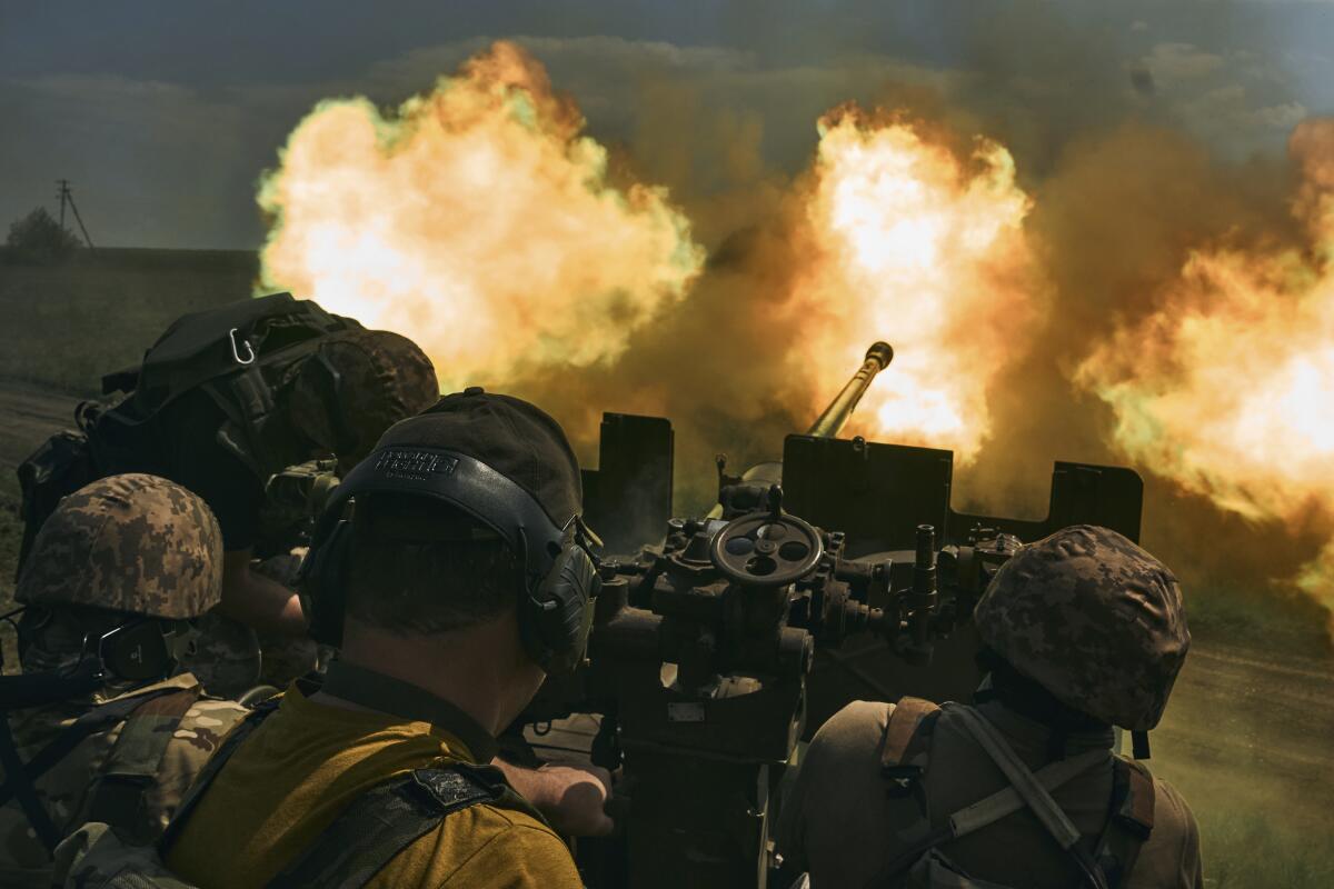 Ukrainian soldiers firing a cannon near Bakhmut