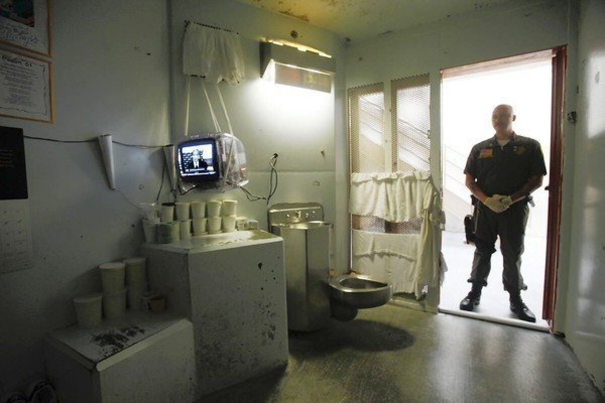 A guard stands in the doorway of a cell at the Secure Housing Unit at Pelican Bay State Prison in Crescent City, Calif. The long-running hunger strike was directed at incarceration of inmates in such units.
