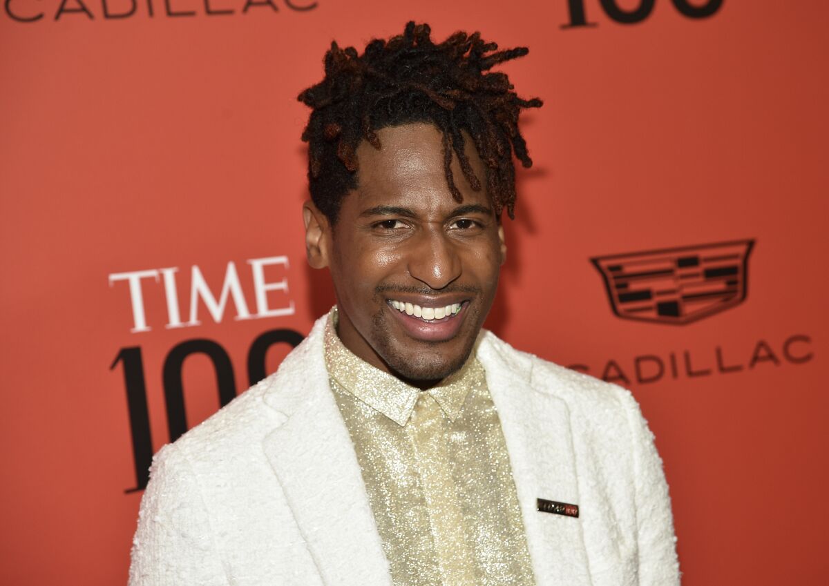 FILE - Jon Batiste attends the TIME100 Gala in New York on June 8, 2022. Batiste is leaving “The Late Show with Stephen Colbert” as bandleader after a seven-year run. Louis Cato, who has served as interim bandleader this summer, will take over on a permanent basis when the show returns for its eighth season. (Photo by Evan Agostini/Invision/AP, File)