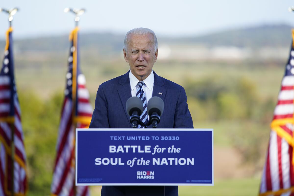 Joe Biden speaks at a podium outside Gettysburg National Military Park.