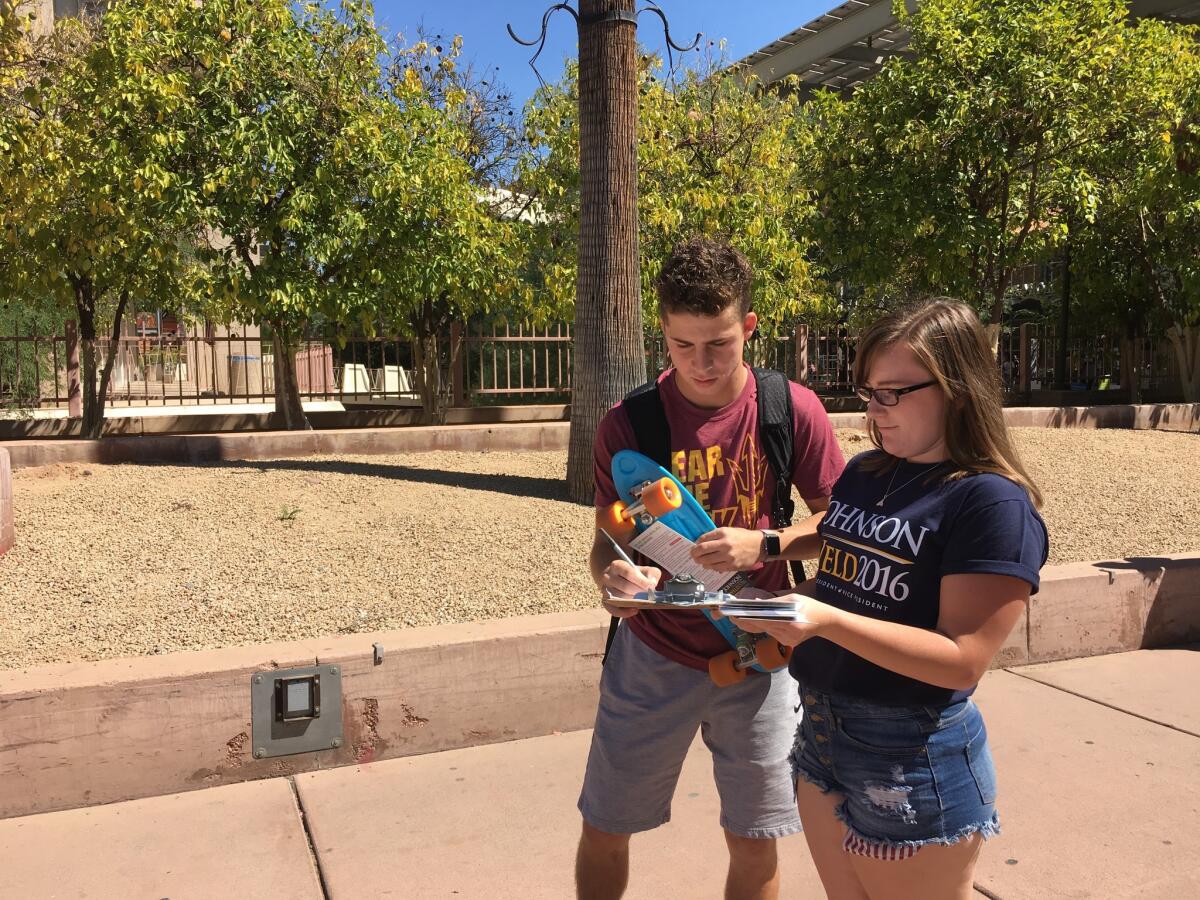 Lauren McCarthy signs up Arizona State University student Brett Amaral to the Johnson campaign mailing list.