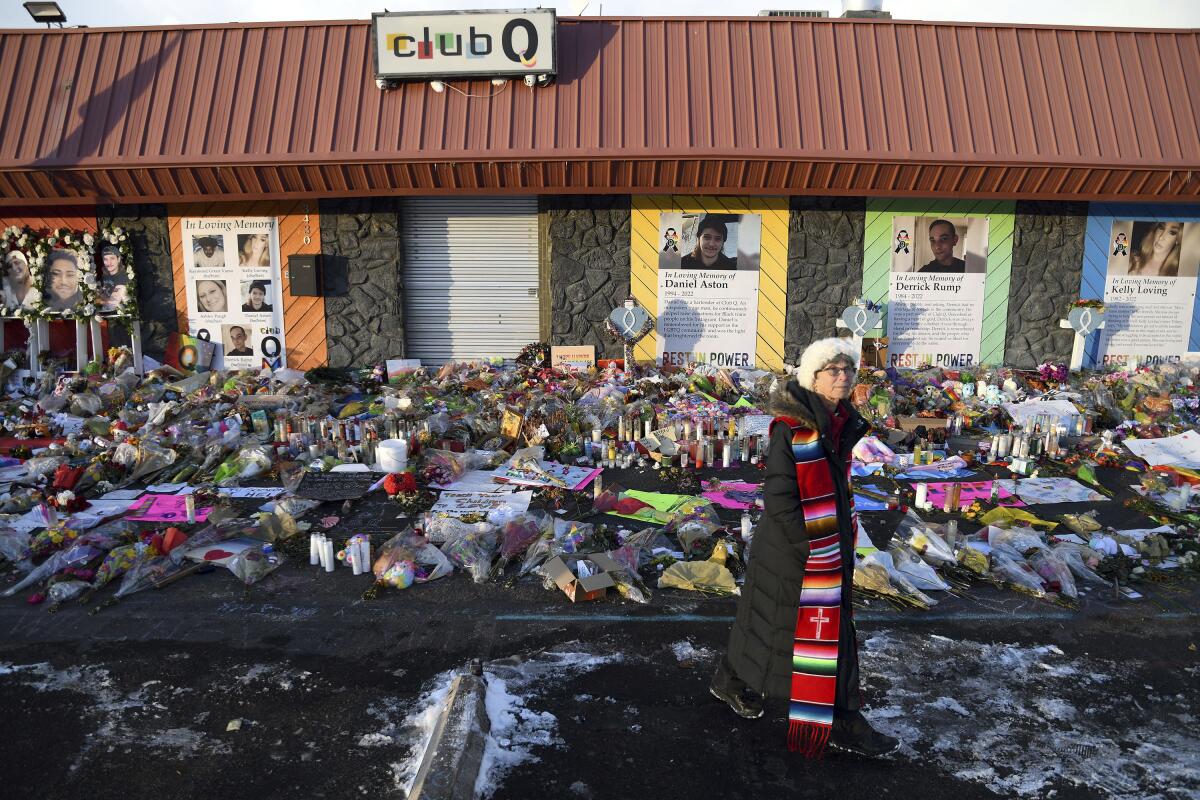 Flowers and other mementos form a memorial outside Club Q.