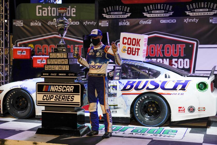 Kevin Harvick (4) celebrates a win at the NASCAR Cup Series auto race, Sunday, Sept. 6, 2020, in Darlington, S.C. (AP Photo/Chris Carlson)