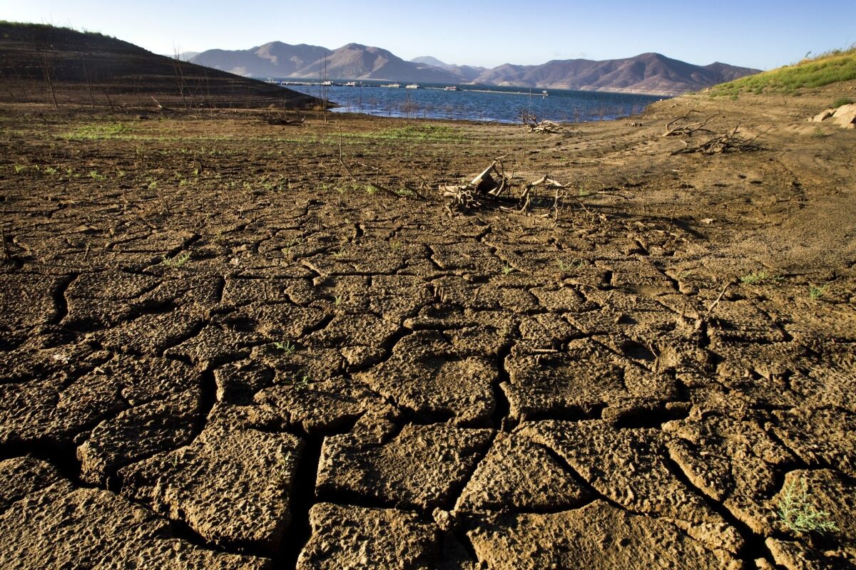 The banks of Diamond Valley Lake in Hemet are dry and cracked. Though agriculture would shrink under chronically dry conditions, California on the whole wouldn't collapse.