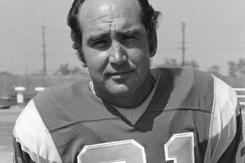 Shown in photo is John Hadl, (21), of Los Angeles Rams shown in August 1973. (AP Photo)