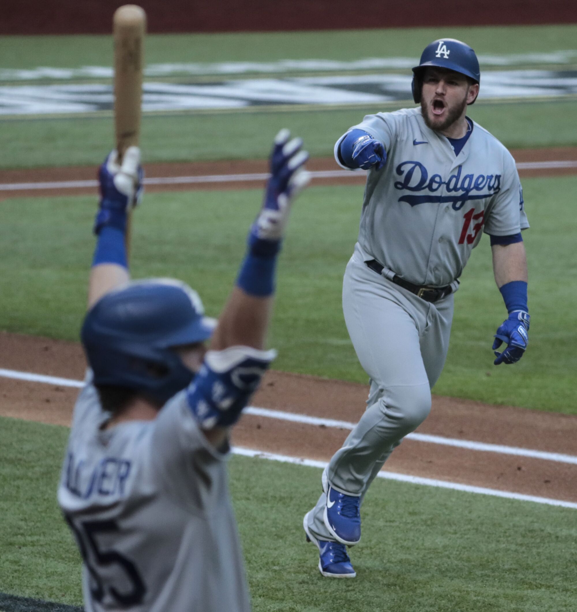 Dodgers first baseman Max Muncy celebrates after hitting a grand slam in the first inning of Game 3 of the NLCS.