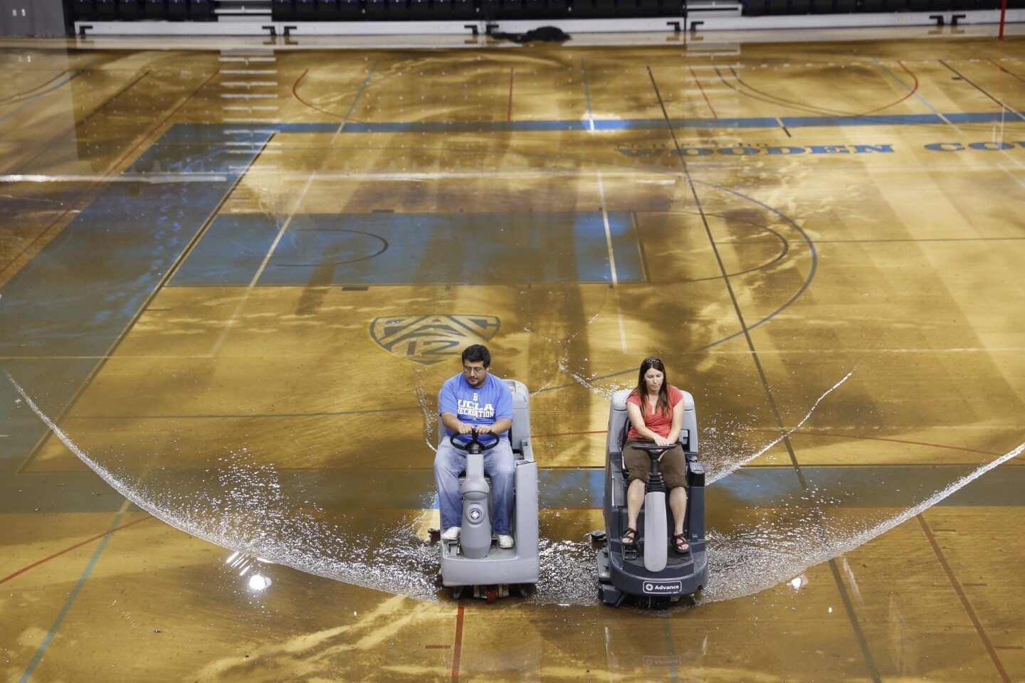 Water is cleared from the floor of Pauley Pavilion on the UCLA campus after a water main broke on Sunset Boulevard.