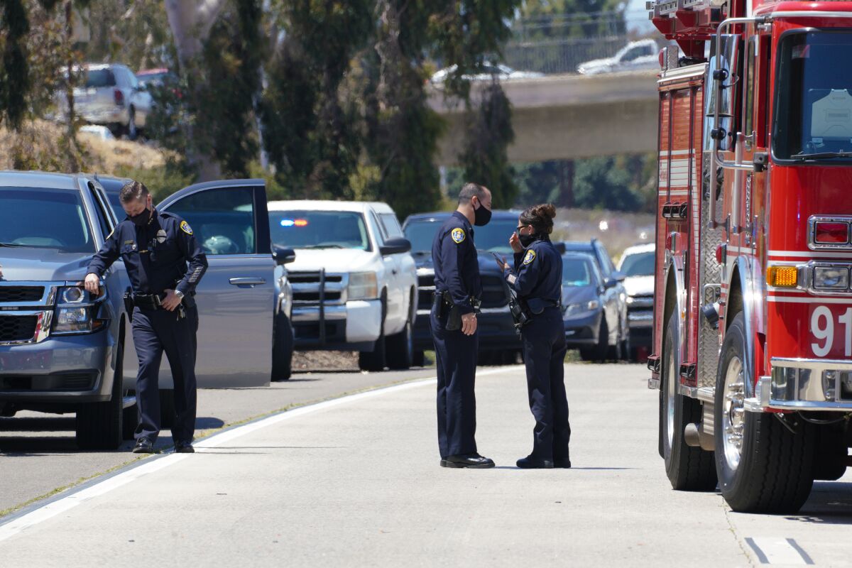 Two police officers talk at scene of fatal I-5 crash